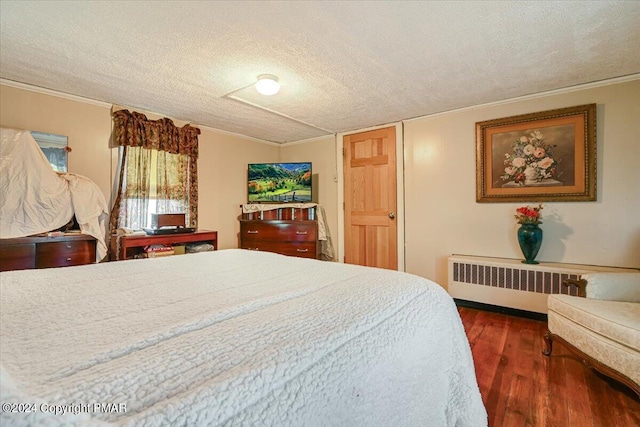 7714 Cherry Valley Rd, Delaware Water Gap, PA 18327 - bedroom with radiator heating unit, a textured ceiling, crown molding, and wood finished floors