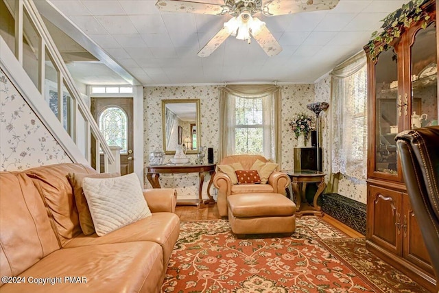 7714 Cherry Valley Rd, Delaware Water Gap, PA 18327 - sitting room with wood finished floors, ceiling fan, stairway, and wallpapered walls