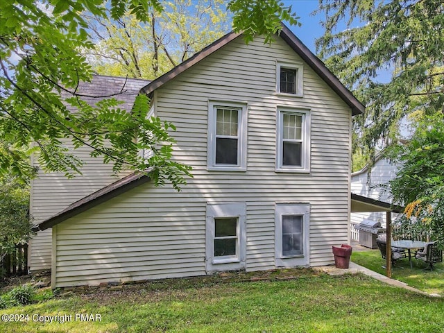 7714 Cherry Valley Rd, Delaware Water Gap, PA 18327 - rear view of house featuring a lawn