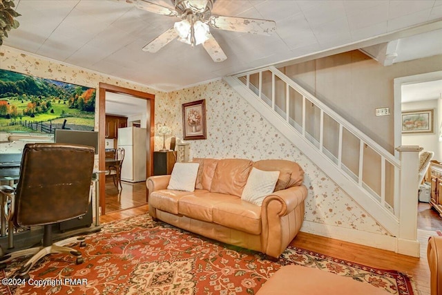 7714 Cherry Valley Rd, Delaware Water Gap, PA 18327 - living area with stairs, a ceiling fan, wood finished floors, and wallpapered walls