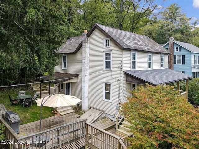 7714 Cherry Valley Rd, Delaware Water Gap, PA 18327 - exterior space with roof with shingles, a chimney, and a wooden deck