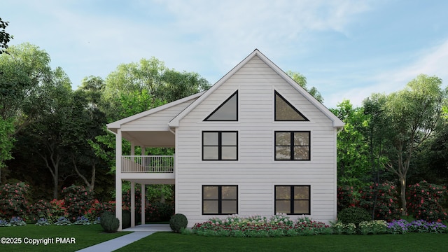 view of front facade with a front yard and a balcony