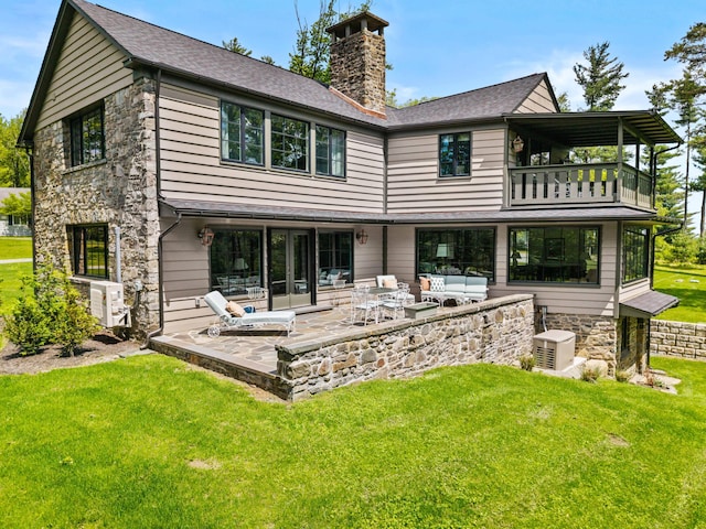 5106 Beattys Cir, Buck Hill Falls, PA 18323 - back of house with a balcony, a yard, a chimney, outdoor lounge area, and a patio area