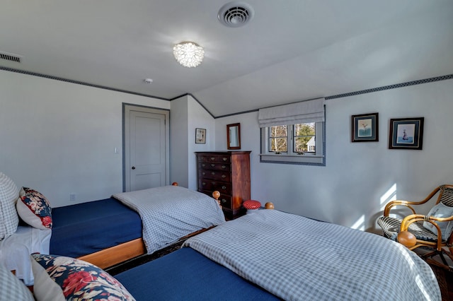 bedroom featuring visible vents and lofted ceiling