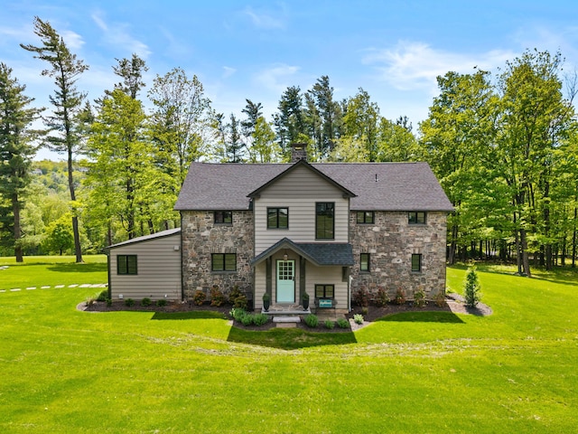 5106 Beattys Cir, Buck Hill Falls, PA 18323 - view of front of home featuring stone siding, a chimney, a front lawn, a shingled roof, and view of scattered trees