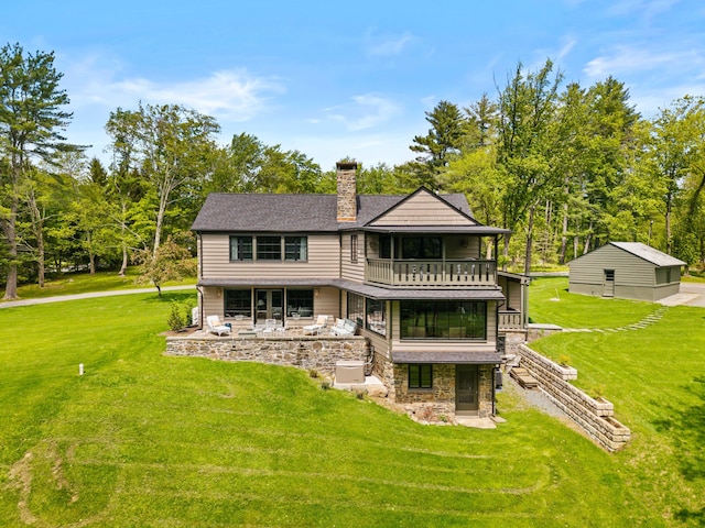 5106 Beattys Cir, Buck Hill Falls, PA 18323 - rear view of house featuring a balcony, stone siding, a yard, and a chimney