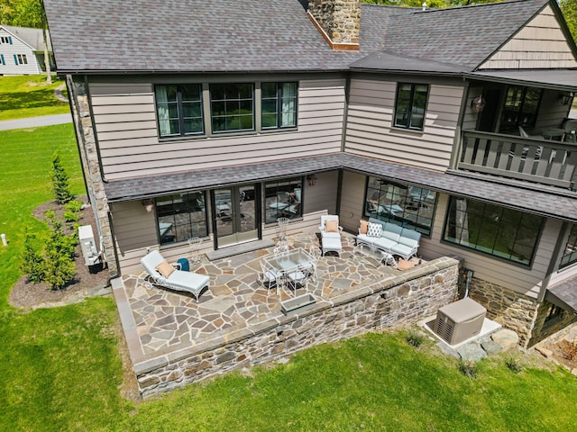 5106 Beattys Cir, Buck Hill Falls, PA 18323 - rear view of house with a lawn, a chimney, a patio area, french doors, and a cooling unit