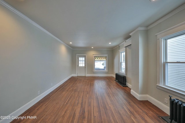 unfurnished living room featuring baseboards, radiator, ornamental molding, wood finished floors, and recessed lighting