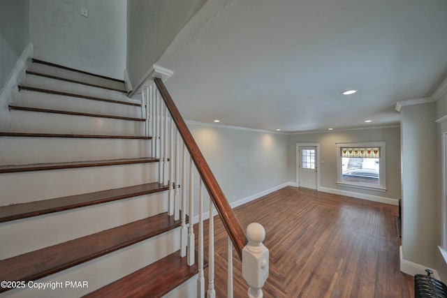 stairway with crown molding, baseboards, wood finished floors, and recessed lighting