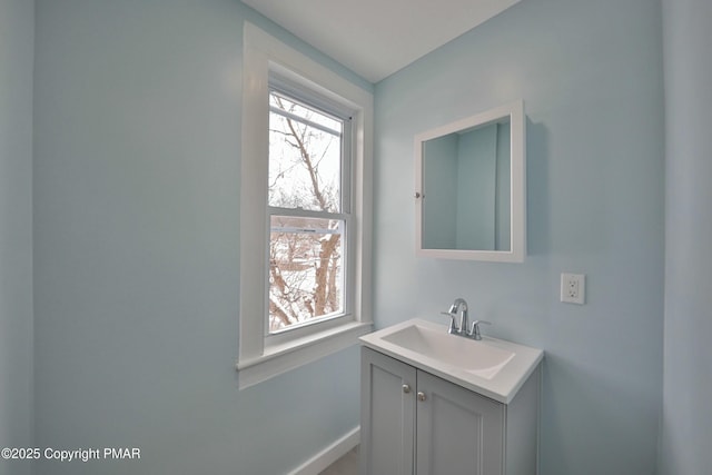 bathroom with baseboards and vanity