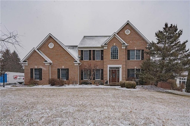 colonial home with brick siding