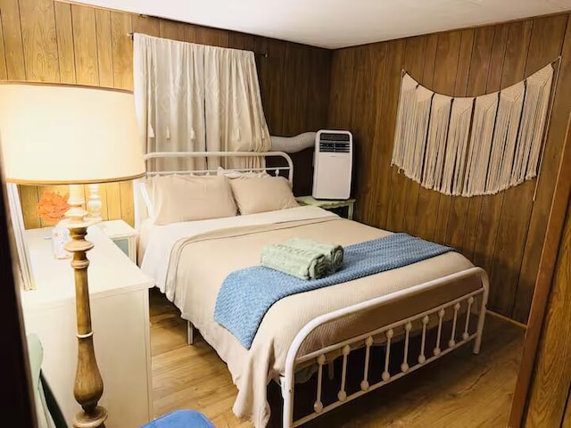 174 Bushkill Dr, Pocono Lake, PA 18347 - bedroom featuring wooden walls and wood finished floors