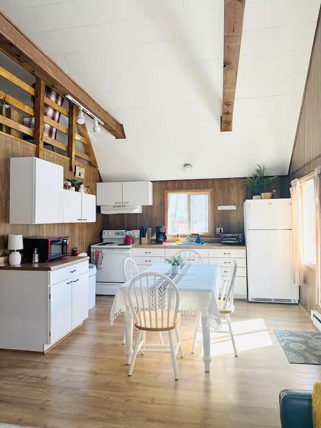 174 Bushkill Dr, Pocono Lake, PA 18347 - kitchen featuring white appliances, wood walls, light wood-style floors, and white cabinetry