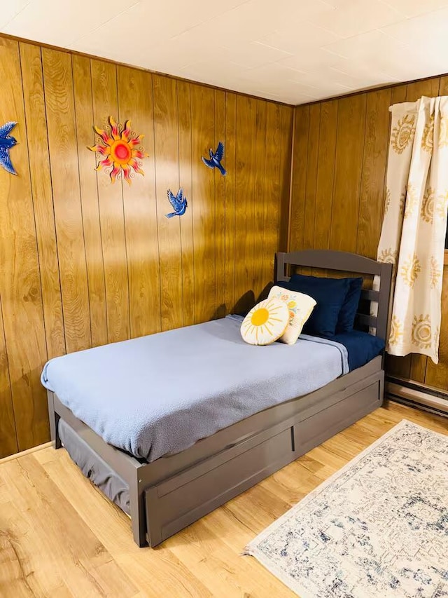 174 Bushkill Dr, Pocono Lake, PA 18347 - bedroom with wood finished floors and wood walls
