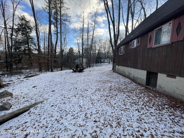 view of yard covered in snow