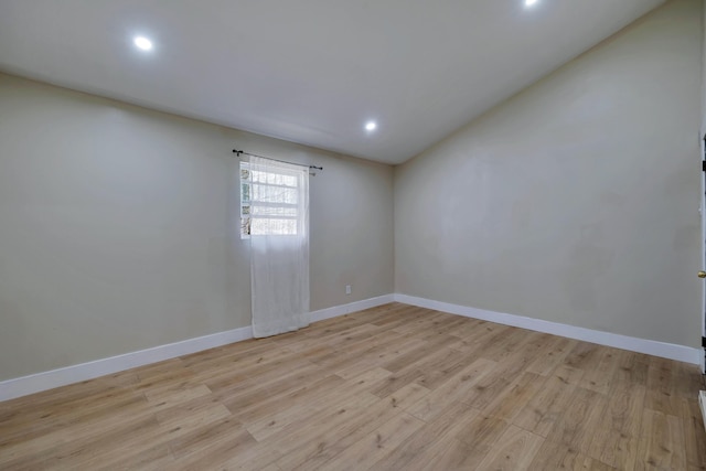 unfurnished room with recessed lighting, baseboards, and light wood-style floors