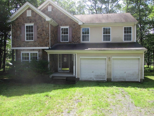 2113 Dorset Ct, Bushkill, PA 18324 - view of front of property featuring stone siding, driveway, an attached garage, and a front lawn