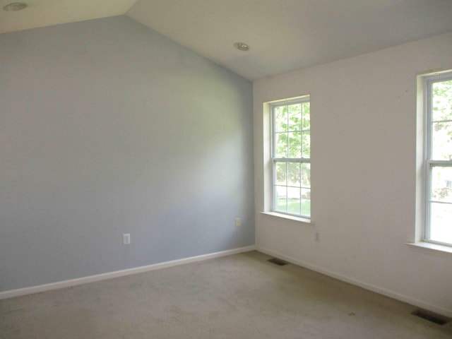 2113 Dorset Ct, Bushkill, PA 18324 - unfurnished room with lofted ceiling, plenty of natural light, and light colored carpet