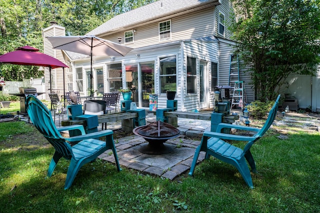 9 Hickory Dr, East Stroudsburg, PA 18301 - back of house featuring an outdoor fire pit, a patio area, and roof with shingles