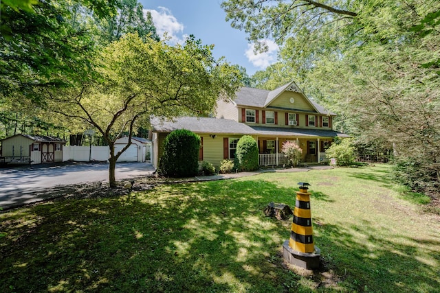9 Hickory Dr, East Stroudsburg, PA 18301 - view of front facade with asphalt driveway, a porch, and an outdoor structure