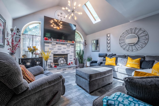 9 Hickory Dr, East Stroudsburg, PA 18301 - living area with a skylight, wood finished floors, plenty of natural light, a glass covered fireplace, and high vaulted ceiling