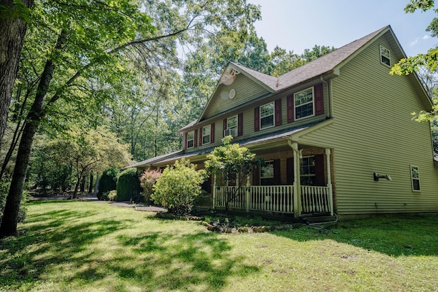 9 Hickory Dr, East Stroudsburg, PA 18301 - view of side of property featuring covered porch and a yard