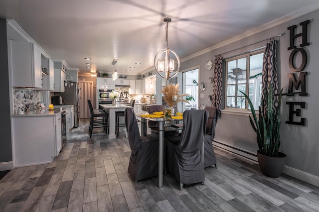 9 Hickory Dr, East Stroudsburg, PA 18301 - dining area featuring a chandelier, wood finished floors, a baseboard heating unit, ornamental molding, and wine cooler