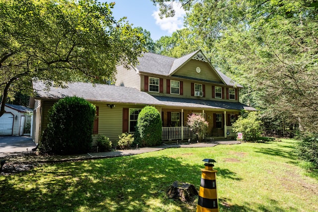 9 Hickory Dr, East Stroudsburg, PA 18301 - view of front of house with a porch, a front lawn, an outdoor structure, and a garage