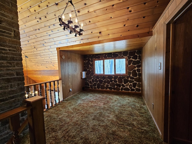 130 Michigana Dr, Pocono Lake, PA 18347 - bonus room featuring wood walls, an inviting chandelier, and carpet