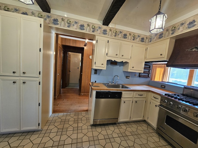 130 Michigana Dr, Pocono Lake, PA 18347 - kitchen featuring pendant lighting, beamed ceiling, light countertops, a sink, and appliances with stainless steel finishes