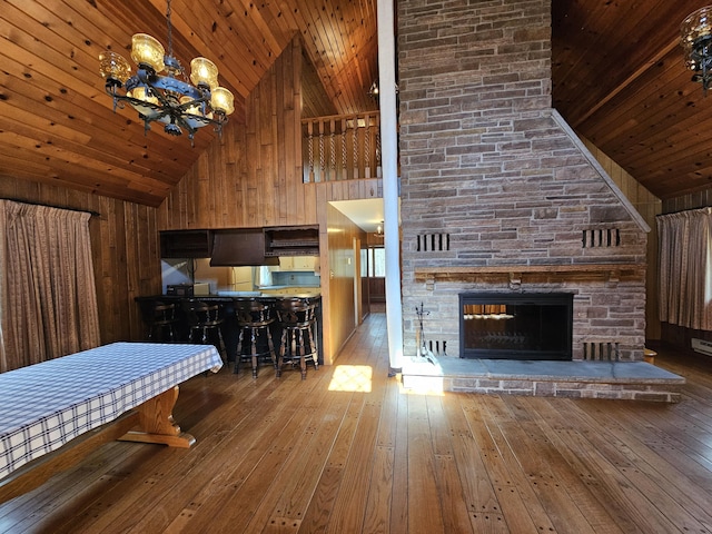 130 Michigana Dr, Pocono Lake, PA 18347 - living area with an inviting chandelier, wood ceiling, high vaulted ceiling, and hardwood / wood-style flooring
