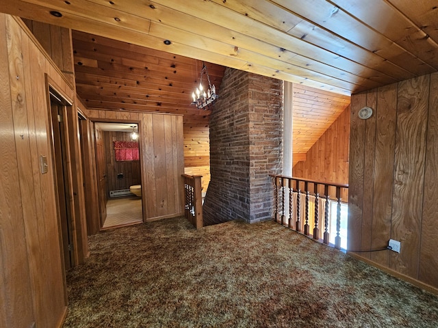 130 Michigana Dr, Pocono Lake, PA 18347 - hallway featuring wood ceiling, vaulted ceiling, wood walls, an upstairs landing, and carpet