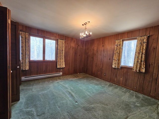 130 Michigana Dr, Pocono Lake, PA 18347 - unfurnished room featuring carpet floors, wood walls, a chandelier, and baseboard heating