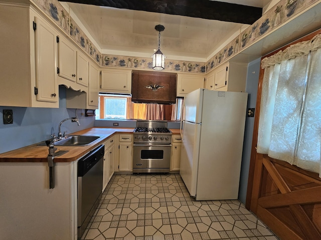 130 Michigana Dr, Pocono Lake, PA 18347 - kitchen with pendant lighting, butcher block counters, white cabinets, a sink, and stainless steel appliances