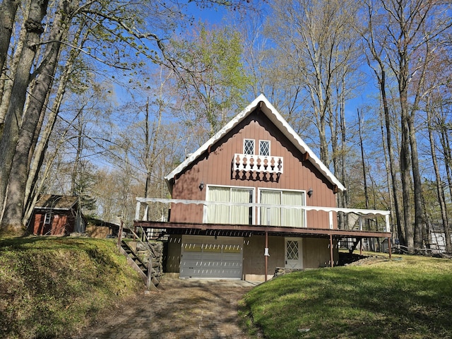 130 Michigana Dr, Pocono Lake, PA 18347 - rustic home with a wooden deck, driveway, stairway, and a front yard