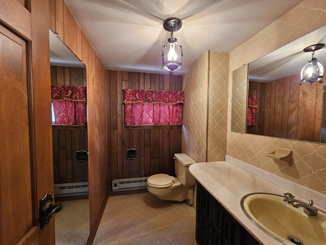 130 Michigana Dr, Pocono Lake, PA 18347 - bathroom with baseboard heating, vanity, a baseboard heating unit, toilet, and wooden walls