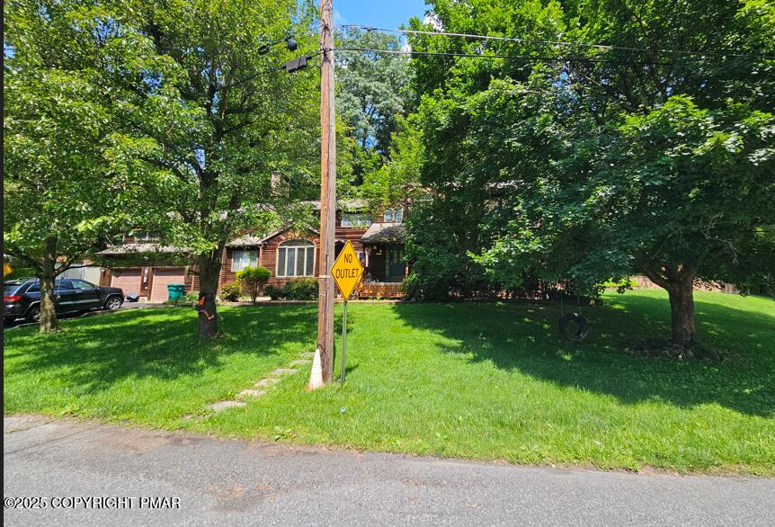 236 Secor Ave St, East Stroudsburg, PA 18301 - obstructed view of property with a front lawn