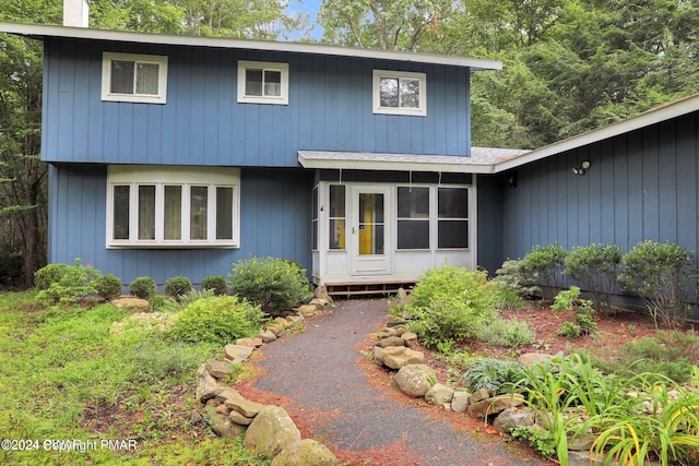 view of front of property featuring a chimney