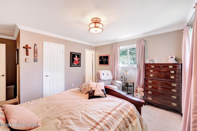 bedroom with crown molding and carpet