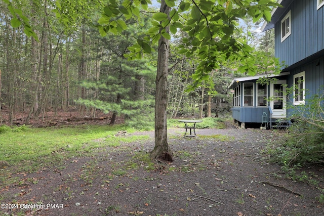 view of yard with a sunroom