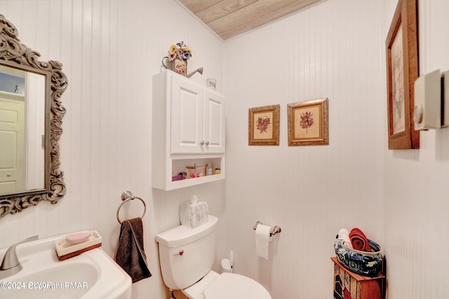 bathroom with toilet and a sink