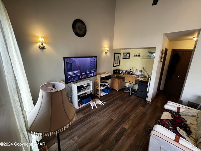 office space with dark wood-style floors and built in desk