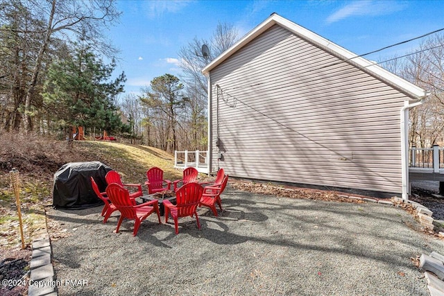 view of patio / terrace with an outdoor fire pit and grilling area