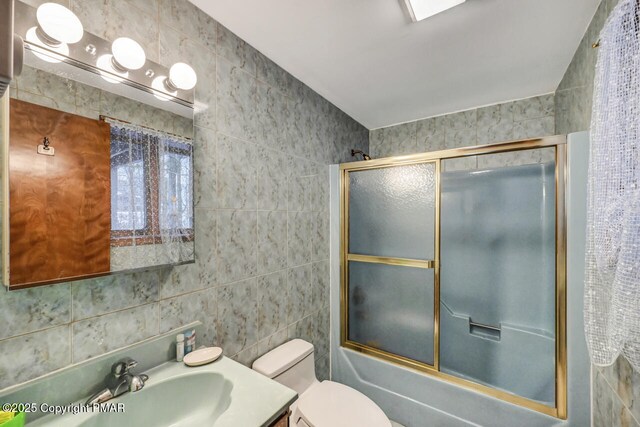 kitchen featuring a baseboard radiator, light tile patterned floors, ceiling fan, and light stone counters