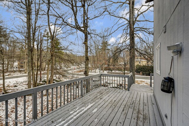 view of snow covered deck