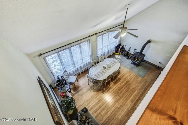 living room featuring baseboard heating and light hardwood / wood-style floors