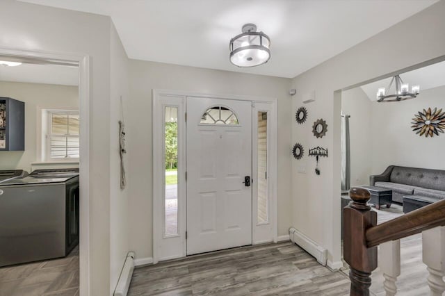 5117 Hounds Ear Rd, Tobyhanna, PA 18466 - entryway featuring baseboard heating, washer and dryer, and plenty of natural light
