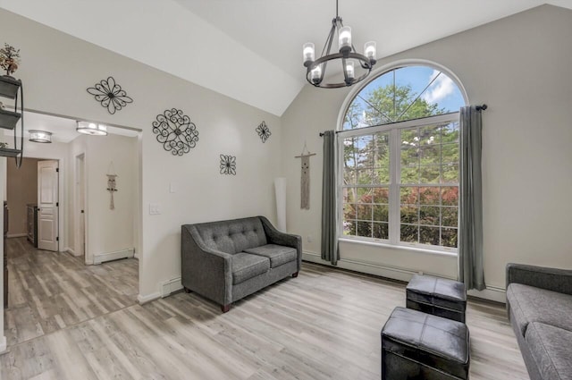 5117 Hounds Ear Rd, Tobyhanna, PA 18466 - living room with a baseboard heating unit, a chandelier, light wood-style floors, high vaulted ceiling, and baseboard heating