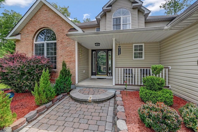 5117 Hounds Ear Rd, Tobyhanna, PA 18466 - property entrance featuring brick siding and covered porch