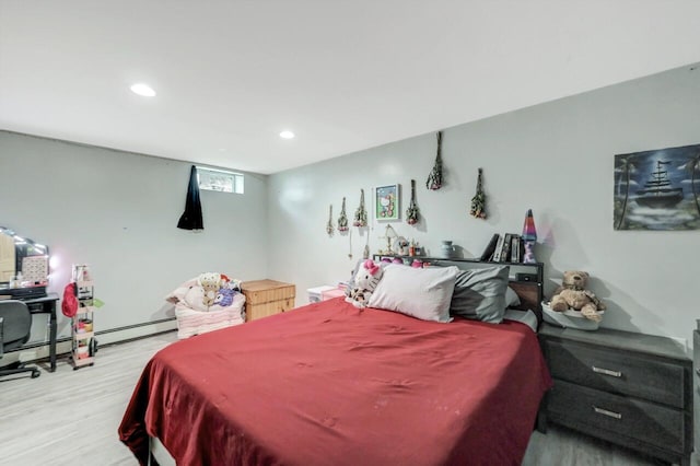5117 Hounds Ear Rd, Tobyhanna, PA 18466 - bedroom with wood finished floors, recessed lighting, and a baseboard radiator